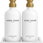 Elegant gold glass hand and dish soap dispenser set by Brighter Barns with two bottles and a ceramic tray.