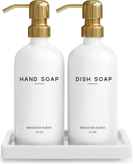 Elegant gold glass hand and dish soap dispenser set by Brighter Barns with two bottles and a ceramic tray.