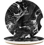 A pair of round black marble patterned ceramic stone car coasters with a cork base, designed to fit vehicle cupholders.