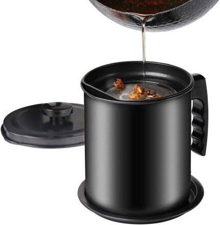 Black Cambom bacon grease container with a fine mesh strainer and a black coaster tray, on a white background.
