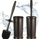 Two HAMITOR modern bronze toilet brushes with their matching round holders, standing upright on a bathroom floor.