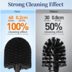 Two HAMITOR modern bronze toilet brushes with their matching round holders, standing upright on a bathroom floor.