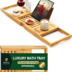ROYAL CRAFT WOOD Premium Foldable Bathtub Tray Caddy in natural bamboo, holding a book, wine glass, and candle.
