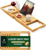 ROYAL CRAFT WOOD Premium Foldable Bathtub Tray Caddy in natural bamboo, holding a book, wine glass, and candle.