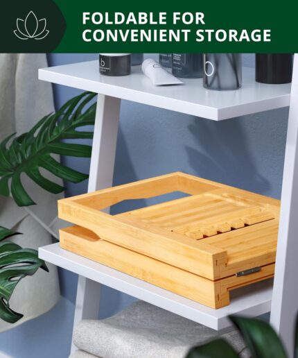 ROYAL CRAFT WOOD Premium Foldable Bathtub Tray Caddy in natural bamboo, holding a book, wine glass, and candle.