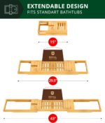 ROYAL CRAFT WOOD Premium Foldable Bathtub Tray Caddy in natural bamboo, holding a book, wine glass, and candle.