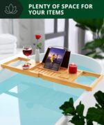 ROYAL CRAFT WOOD Premium Foldable Bathtub Tray Caddy in natural bamboo, holding a book, wine glass, and candle.