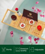 ROYAL CRAFT WOOD Premium Foldable Bathtub Tray Caddy in natural bamboo, holding a book, wine glass, and candle.