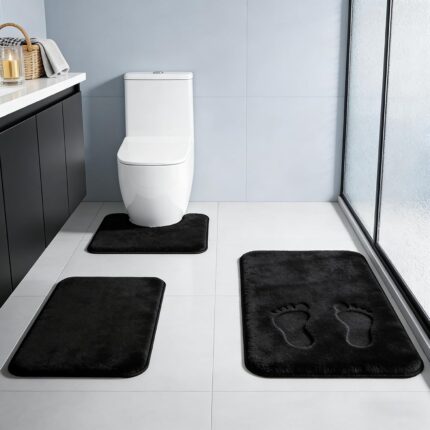 Three-piece RUN HELIX black memory foam bath rug set on a tile floor, showing large, small, and U-shape mats.