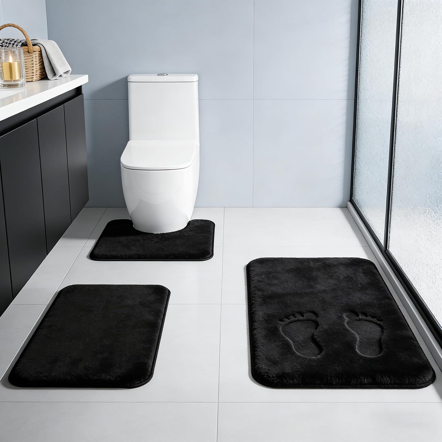 run-helix-black-memory-foam-bath-rug-set-3-piece-20x32-16x24-20x20-u-shape-01 Three-piece RUN HELIX black memory foam bath rug set on a tile floor, showing large, small, and U-shape mats.