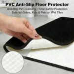Three-piece RUN HELIX black memory foam bath rug set on a tile floor, showing large, small, and U-shape mats.