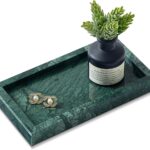 A rectangular green marble vanity tray by Sumlus, holding a small perfume bottle and a few pieces of jewelry.