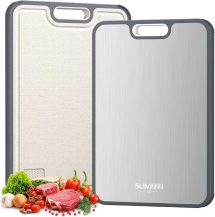 A sleek, silver rectangular Sumzzz titanium cutting board with a juice groove and garlic grinding area, shown on a kitchen co