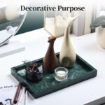 A rectangular dark green natural marble vanity tray, polished and smooth, on a light surface, showcasing its unique veining.