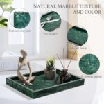 A rectangular dark green natural marble vanity tray, polished and smooth, on a light surface, showcasing its unique veining.