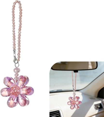 A vibrant Zigeiya pink crystal 3D flower charm hanging, reflecting colorful light against a soft background.